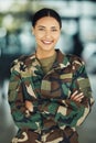 Portrait, military and woman with arms crossed, smile and war with protection, confident and power. Person, security and