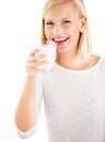 Portrait, milk and smile with a woman drinking from a glass in studio isolated on a white background. Health, nutrition Royalty Free Stock Photo