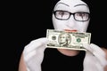 Portrait of mime with 10 dollar denomination Royalty Free Stock Photo