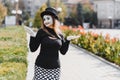 Portrait of a mime comedian. mime girl on the street