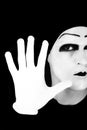 Portrait of the mime in white gloves. Stop it. Royalty Free Stock Photo