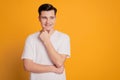 Portrait of minded happy young man dreaming look empty space isolated over yellow background Royalty Free Stock Photo