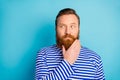 Portrait of minded pensive ginger hair beard man look copyspace think thoughts want solve work problems wear nautical
