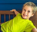 Portrait mischievous cute blond blue eyed boy making freckles face play laughing in happy mood. Funny photo, happiness