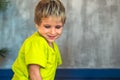 Portrait mischievous cute blond blue eyed boy making freckles face play laughing in happy mood. Funny photo, happiness