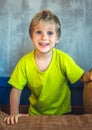 Portrait mischievous cute blond blue eyed boy making freckles face play laughing in happy mood. Funny photo, happiness