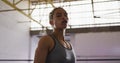 Fit mixed race woman in boxing gym