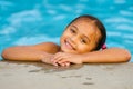 Portrait of mixed race girl in pool Royalty Free Stock Photo