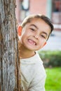 Mixed Race Young Hispanic Caucasian Boy By a Tree Royalty Free Stock Photo