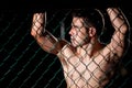 Portrait of a MMA fighter in a cage