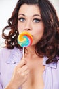 Portrait, model and candy lollipop in studio by sugar food and happiness for sweets in mouth. Young woman, french and