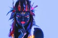 Model in image of Native american with neon makeup, which made of fluorescent paint in ultraviolet light. Royalty Free Stock Photo