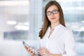 Portrait of modern business woman working with tablet computer in the office