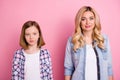 Portrait of modern family mum and daughter look in camera wear casual style clothes isolated over pastel color