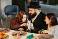 Jewish Father Giving Presents To Kids