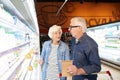 Senior Couple Choosing Milk Royalty Free Stock Photo