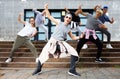 Modern teenager performing street dance with group