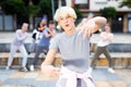 Modern teenager performing street dance with group