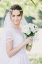 Portrait of modest bride a bouquet of flowers