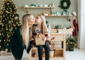 Portrait of mom and daughter in anticipation of Christmas. Royalty Free Stock Photo