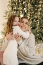 Portrait of mom and daughter in Christmas time. Happy family spent time together during the holiday Royalty Free Stock Photo