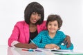 Portrait of mom helping son with homework. Royalty Free Stock Photo