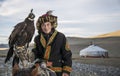 Portrait of a mongolian eagle hunter with his eagle