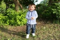 Portrait of 20 months baby boy walking in summer