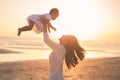 Portrait of mother and baby in the beach at sunset Royalty Free Stock Photo