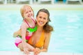 Portrait of mother and baby girl in swimming pool Royalty Free Stock Photo