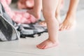 Portrait of mother and baby legs. First steps. home playing. Close-up of female and little baby legs during walk down Royalty Free Stock Photo