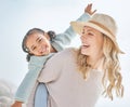 Portrait of a mother and daughter having fun and bonding on a beach vacation together. Happy adopted black child being Royalty Free Stock Photo