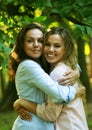 portrait of mother and daughter hugging, summer time, park Royalty Free Stock Photo