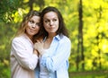 portrait of mother and daughter hugging, summer time, park Royalty Free Stock Photo
