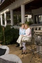 Portrait of mother and daughter on patio Royalty Free Stock Photo