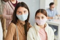 Mother and Daughter wearing Masks in Clinic Royalty Free Stock Photo