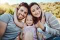 Portrait of mother, father and girl at park enjoying quality time in holiday, weekend and vacation together. Family Royalty Free Stock Photo