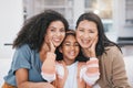 Portrait, mother and grandma of happy child in home living room bonding on sofa. Face, mom and grandmother of girl in