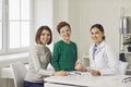 Portrait of mother, her son and female dentist in the office of a modern dental clinic. Royalty Free Stock Photo