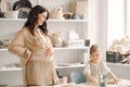 Portrait of mother and little girl shaping clay together Royalty Free Stock Photo