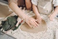 Portrait of mother and little girl shaping clay together Royalty Free Stock Photo