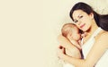 Portrait of mother with sleeping baby lying on the bed together at home Royalty Free Stock Photo