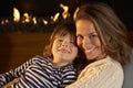 Portrait mother and son by firelight Royalty Free Stock Photo