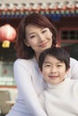 Portrait of mother and son outside traditional Chinese building Royalty Free Stock Photo