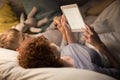 Mother and Son Reading Fairytales in Bed Royalty Free Stock Photo