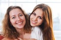 Portrait of a mother and teen daughter being close and hugging Royalty Free Stock Photo