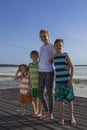 Portrait of mother with three children - boys.