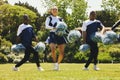 Portrait, motivation and a cheerleader team of young people outdoor for a training routine or sports event. Smile Royalty Free Stock Photo