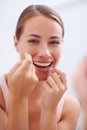 Portrait, mouth and dental floss for oral hygiene care with woman in bathroom of home for teeth whitening. Face, product