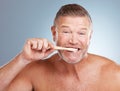 Portrait, mouth or old man brushing teeth with dental toothpaste for healthy oral hygiene grooming in studio. Eco